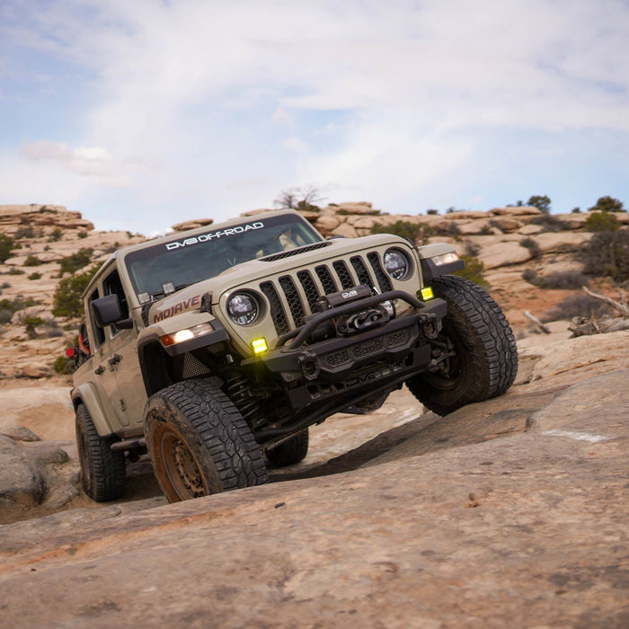 A Jeep JT venturing off-road with DV8 Offroad upgrades.