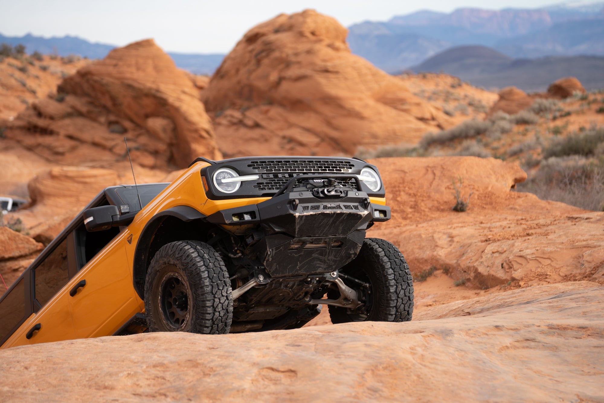 A Bronco outfitted with DV8 traversing off-road.