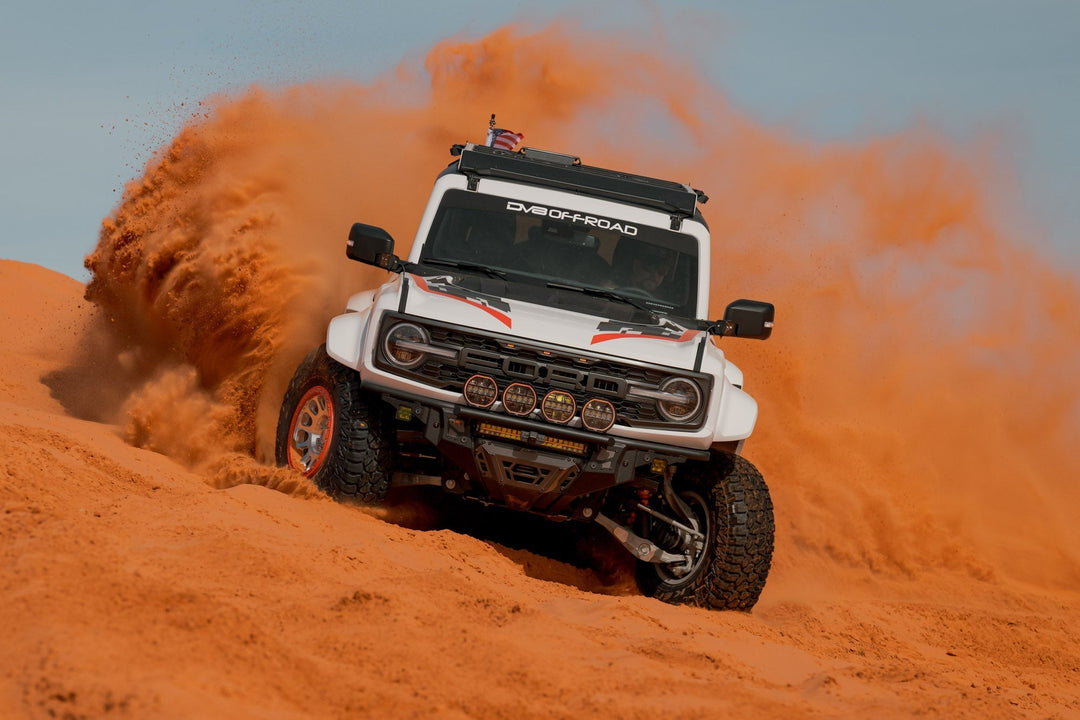 A Bronco Raptor drifting off-road.