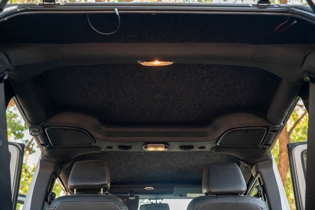 Open 2007-2018 Jeep JK 4-Door with DV8 Fastback Hard Top with view of the carpeted interior finish