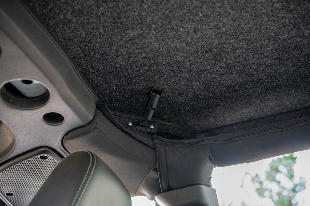 2007-2018 Jeep JK 4-Door with DV8 Fastback Hard Top, close-up of the carpeted interior finish.