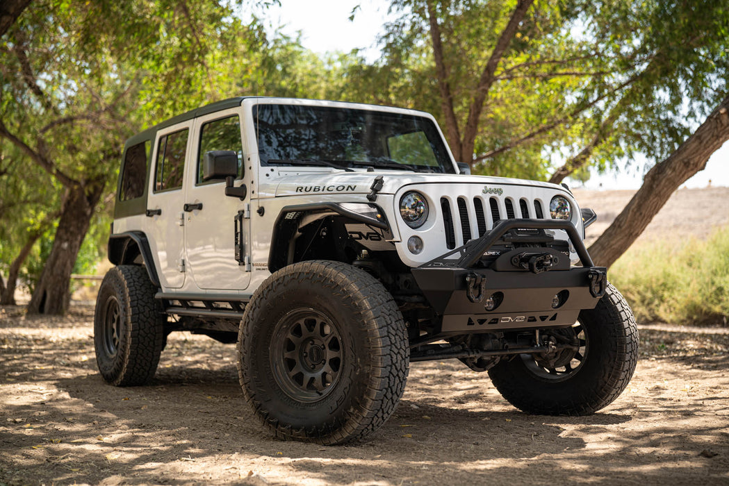 White 2007-2018 Jeep JK 4-Door with DV8 Square Back Hard Top parked on a dirt road with trees in the background