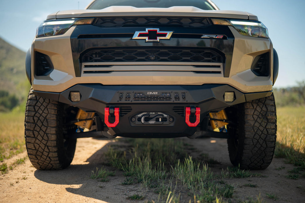 Chevy Colorado ZR2 with Spec Series Front Bumper, off-road tires, and accessories on a dirt road.