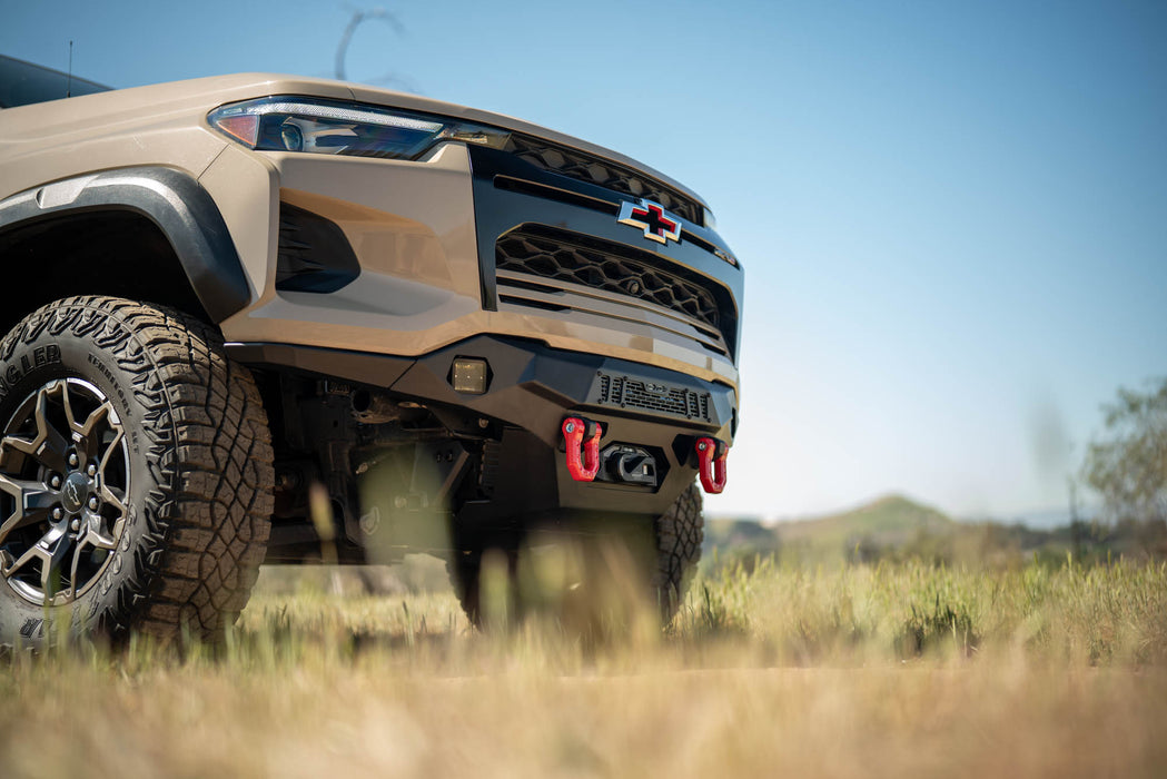 Front view of a beige Chevy Colorado ZR2 with Spec Series Front Bumper and a clear blue sky background