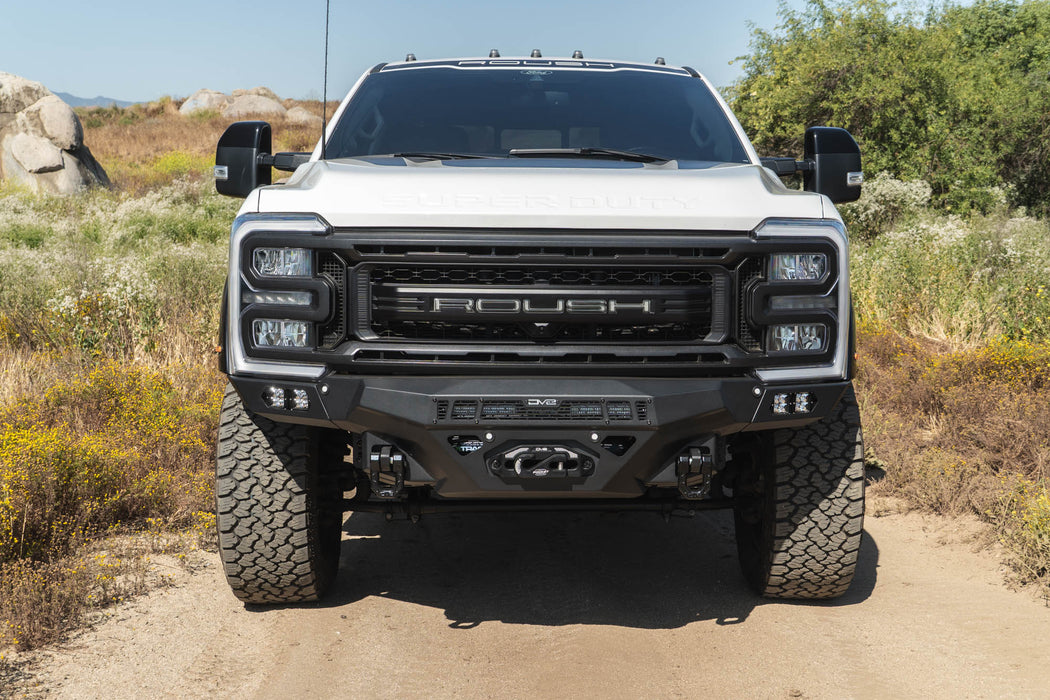 White Ford Super Duty Roush truck on a dirt road with natural landscape in the background, Ford F-250/350 Spec Series Front Bumper installed