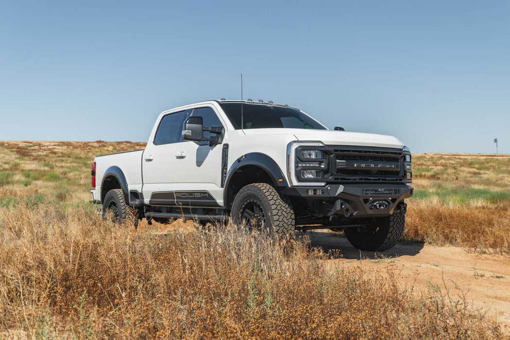 Ford F-250/350 Spec Series Front Bumper on white pickup truck on a dirt road with a clear blue sky