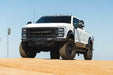 Ford F-250/350 Spec Series Front Bumper on white truck on a dirt road with clear blue sky