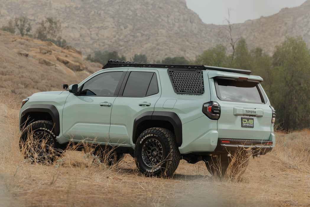 Toyota 4runner driving in the desert mountains with 2025-2026 4Runner Exterior Window Molles for DV8 Roof Rack added to Spec Series roof rack