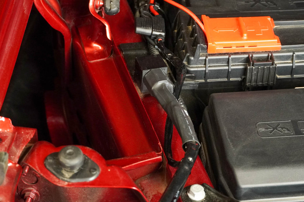 Close-up of a car battery and 40 Amp Wire Harness with DT Connector & Switch
