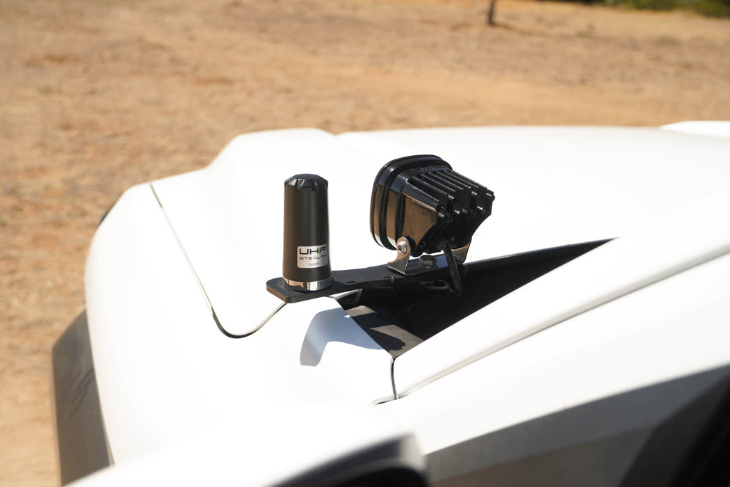 4th Gen Toyota Tacoma Ditch Light Brackets mounted with a blurred natural background