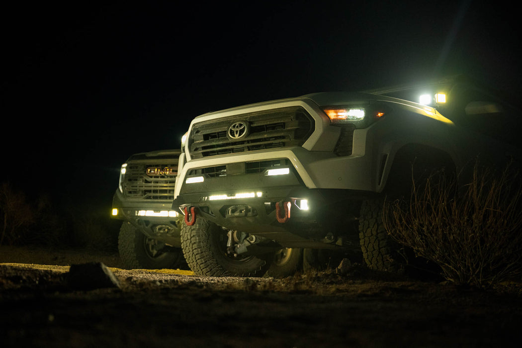 Spec Series Front Bumper on the 4th Gen Toyota Tacoma on a dirt road at night with all lights on.