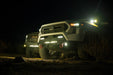 Spec Series Front Bumper on the 4th Gen Toyota Tacoma on a dirt road at night with all lights on.