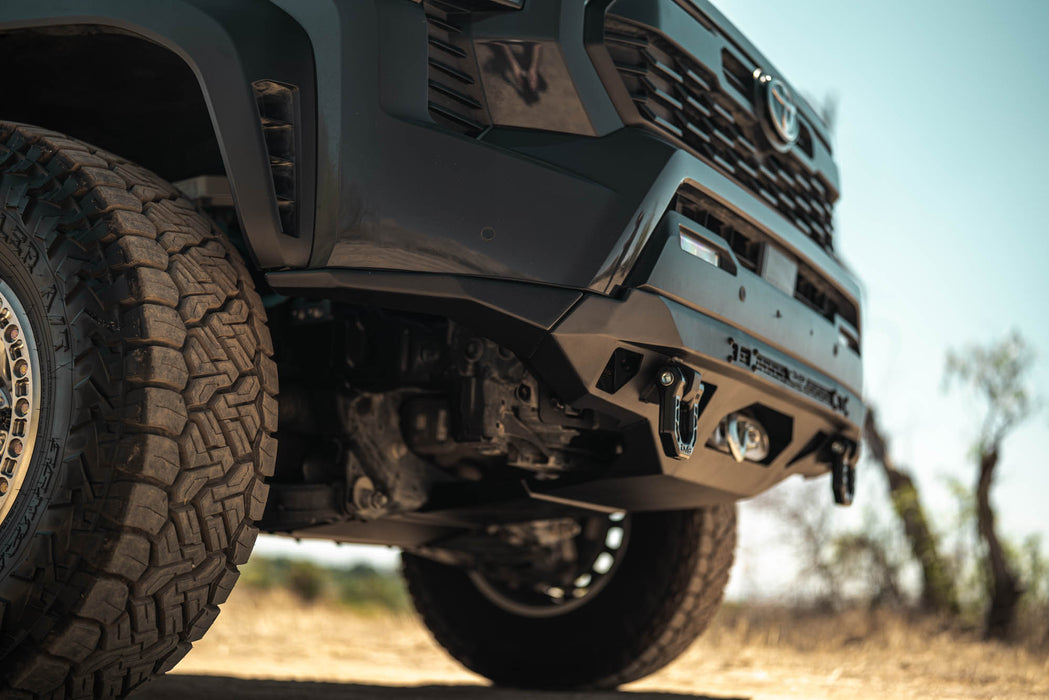 Close-up of a Spec Series Front Bumper on the 4th Gen Toyota Tacoma with a blurred natural background