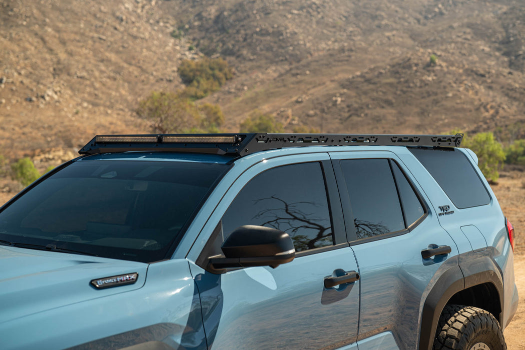 Light blue 6th Gen Toyota 4Runner with Roof Rack Light Cutout installed in a desert landscape
