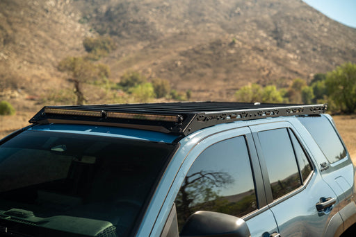 6th Gen Toyota 4Runner Roof Rack Light Cutout with a mountainous landscape in the background