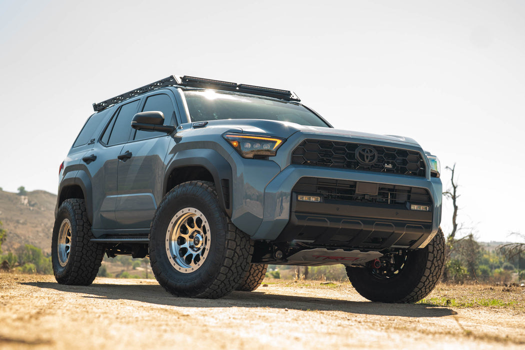 6th Gen Toyota 4Runner Roof Rack Light Cutout installed on a dirt road with a clear sky background