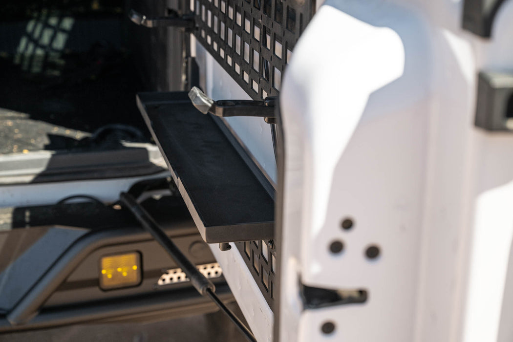 Close-up of Bronco tailgate molle panel with the tray folded down.