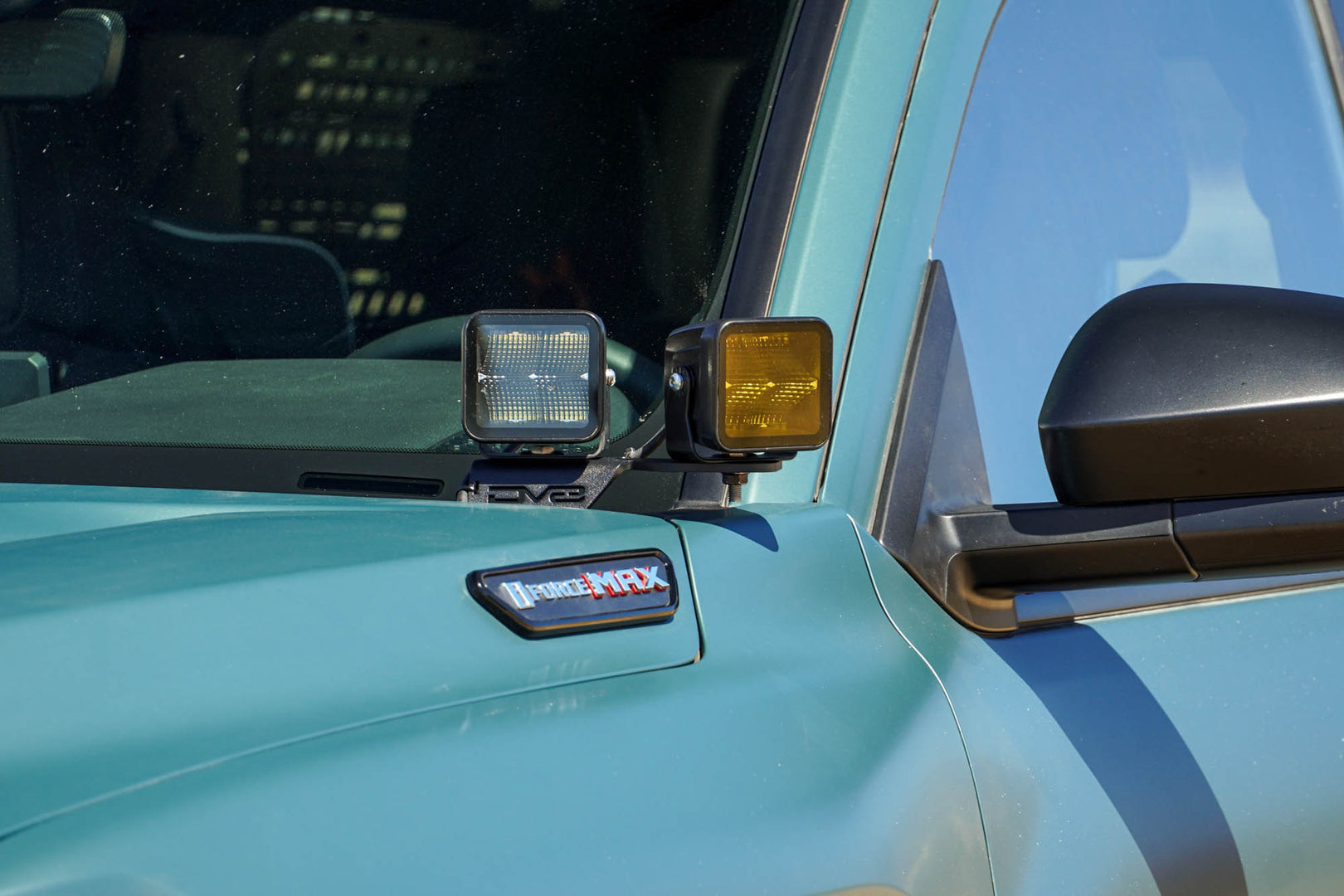 6th Gen Toyota 4Runner Ditch Light Brackets installed with clear and amber light pods.