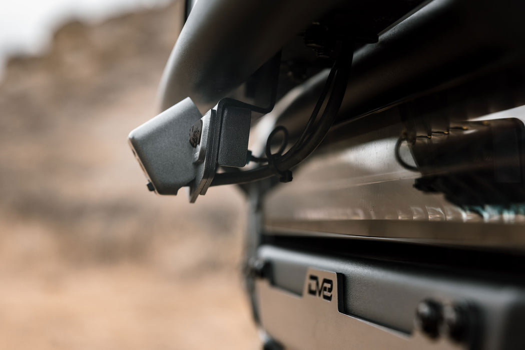 Close-up side view of installed Ford Bronco & Bronco Raptor Tube Front Bumper Camera Relocation Bracket 