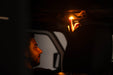 Man pushing on/off button of the Elite White/Amber Push Button Dome Light by DV8 Offroad