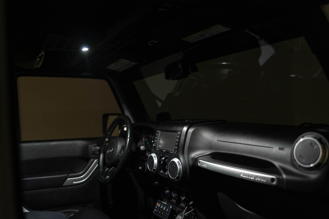 Interior of Jeep with Elite White Push Button Dome Light installed to overhead molle console