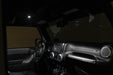 Interior of Jeep with Elite White Push Button Dome Light installed to overhead molle console