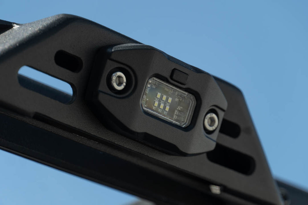 Elite White Push Button Dome Light mounted to roof rack side rail