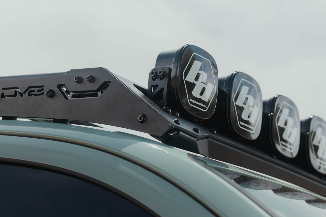 Installed Baja Designs Linkable Lightbar Mount for DV8 Roof Rack Light Option view from passenger side