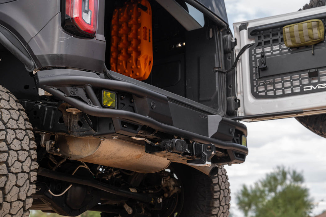Close-up of Ford Bronco Rear Tube Bumper installed, and tire with a cloudy sky in the background