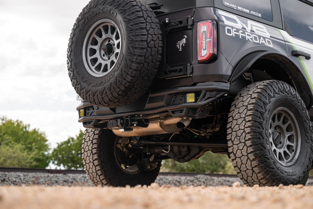Close-up of Ford Bronco Rear Tube Bumper installed, on a gravel surface.