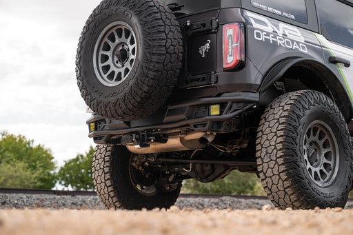 Close-up of Ford Bronco Rear Tube Bumper installed, on a gravel surface.