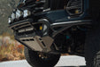Angled view of 2023+ Chevy Colorado Tube Front Bumper with integrated skid plate and push bar