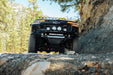 Low-angle view of high-clearance 2023+  Chevy Colorado Tube Front Bumper installed on  Trail Boss on the trail 