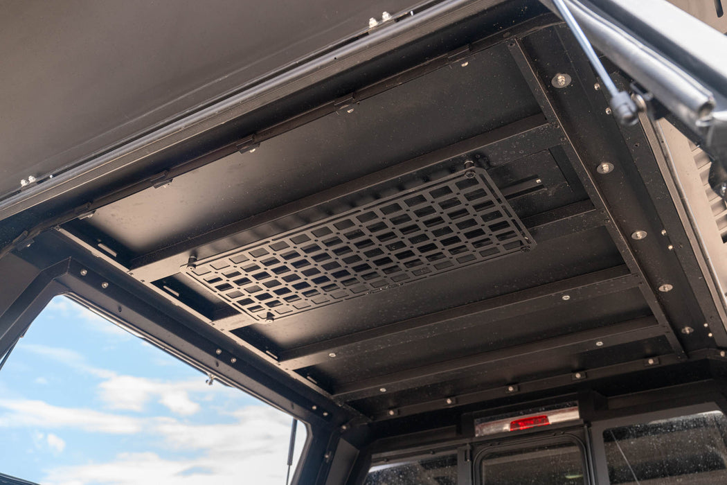 Universal Molle Panel mounted to the interior of a truck rack.