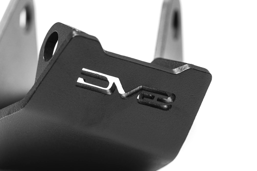 Close-up of a black metal component with 'DV8' branding on a white background