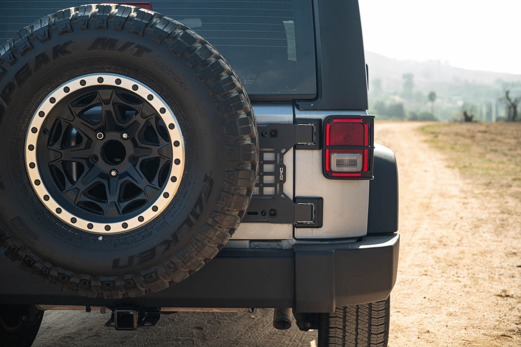 Back view of a vehicle with Jeep Wrangler JK Tailgate Reinforcement Molle Panel