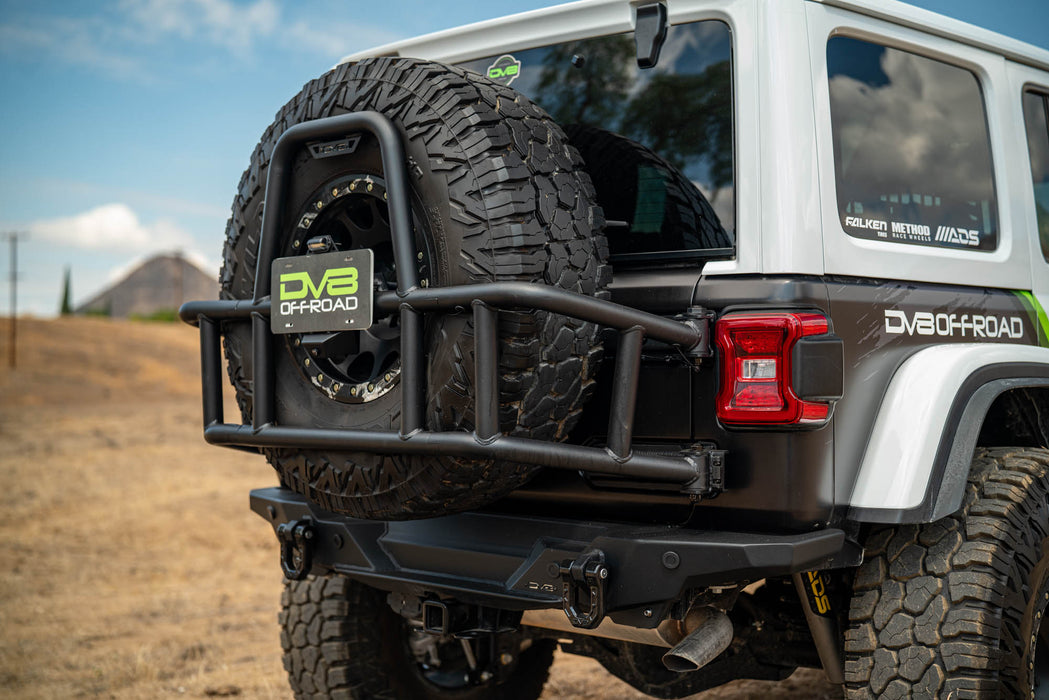 Off-road 2018-2025 Jeep Wrangler JL Body Mounted Tire Carrier on a dirt road