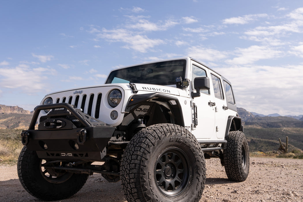 Jeep Wrangler JK exploring desert mountains with dual pod lights mounted 