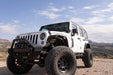 Jeep Wrangler JK exploring desert mountains with dual pod lights mounted 