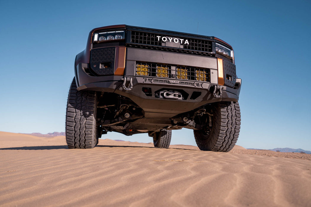 250 Series Land Cruiser with Spec Series Front Bumper on sand dunes with clear blue sky