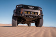 250 Series Land Cruiser with Spec Series Front Bumper on sand dunes with clear blue sky