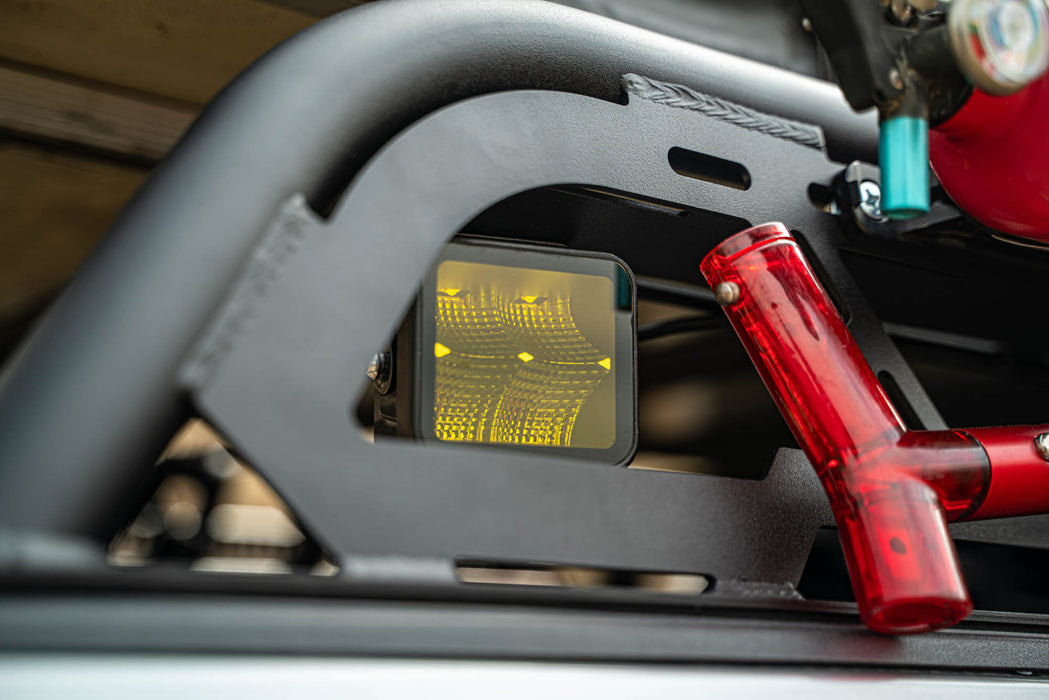 LED Elite Pod Light by DV8 offroad on the Universal MTO Series Mid-Size Truck Bed Rack