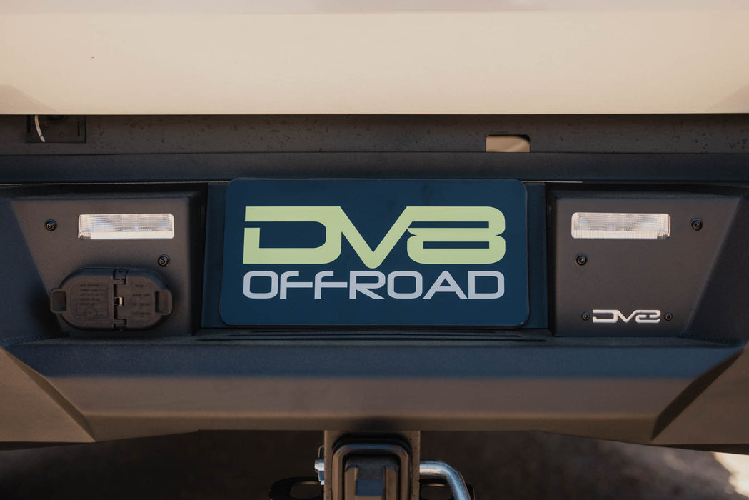 Close up view of integrated license plate area of 2022+ Toyota Tundra Spec Series Rear Bumper, featuring reverse lighting and clean wiring connections