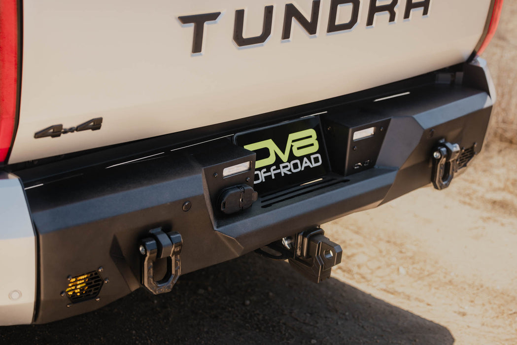 Angled view of 2022+ Toyota Tundra Spec Series Rear Bumper installed on pickup driving dirt roads