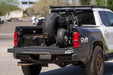 Dirt Bike on the Universal Truck Bed Tire Carrier & Accessory Mount