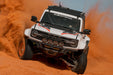 White Ford Bronco Raptor with Tube Front Bumper driving through sand
