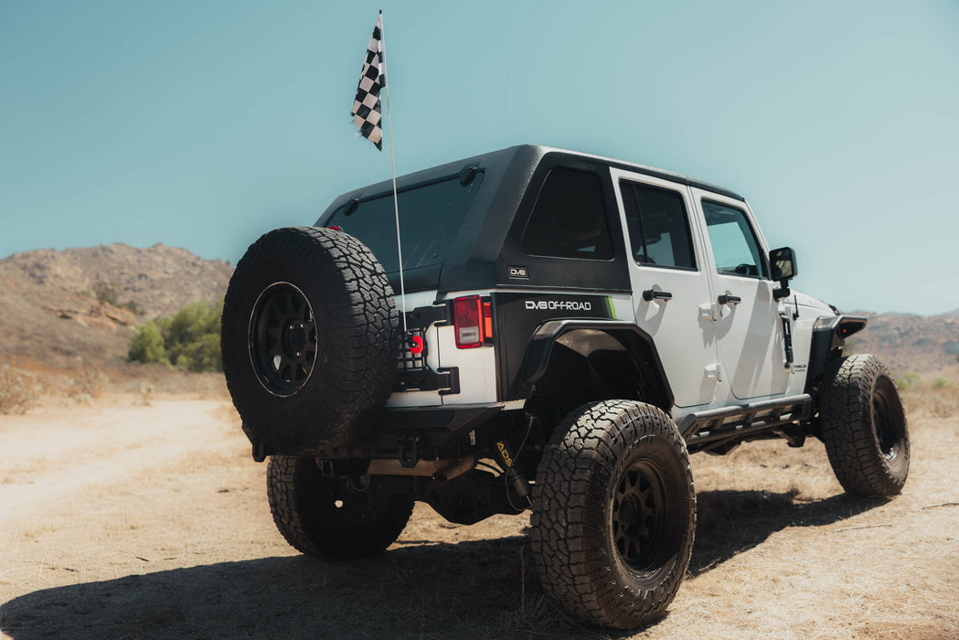Race flag installed on the white DV8 offroad Jeep using Universal Molle Adjustable Antenna & Whip Mount