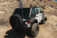 High angle view of Jeep parked in the desert with Universal Molle Adjustable Antenna & Whip Mount used to mount flag on rear door molle panel