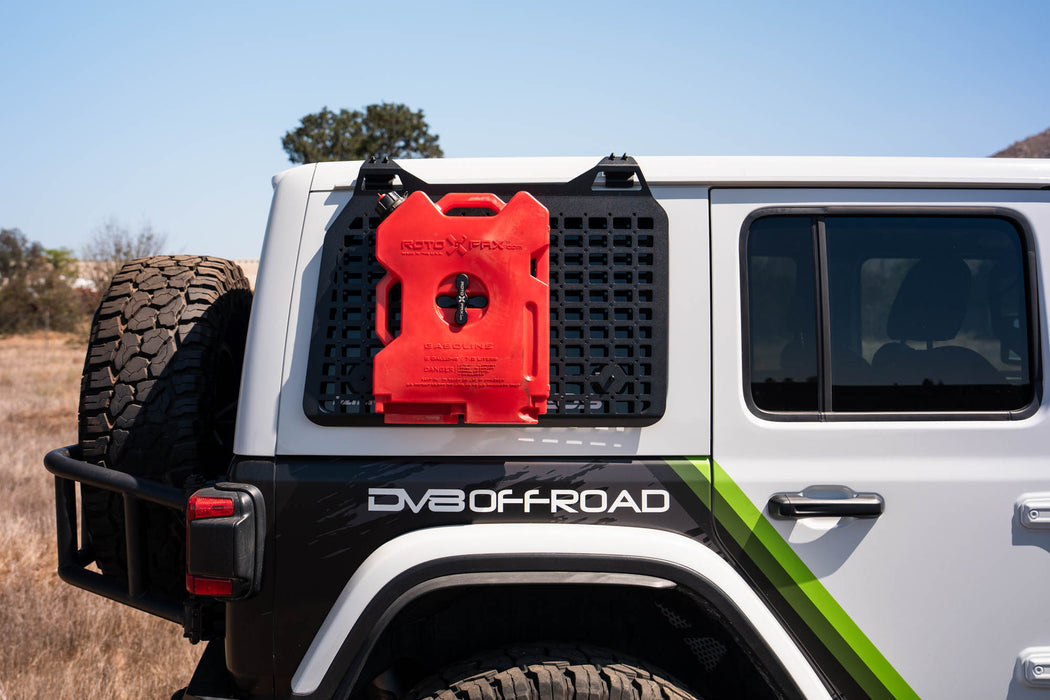 Jeep parked in field with molle panel and Universal Molle Panel Rotopax Mount to mount Rotopax fuel jug