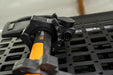 Low angle view of installed Universal Locking Tool Clamp with axe showing size indicators